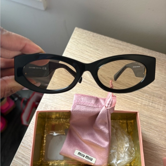 Miu Miu Black Sunglasses with Gold Detailing main image 4